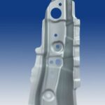 Tall metal part inside blue bkgrd